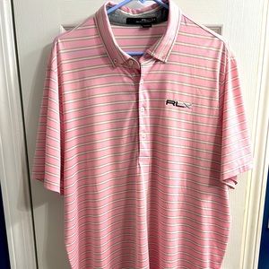 Sharp looking RLX polo. Absent of any flaws. Embroidered logo and loop label